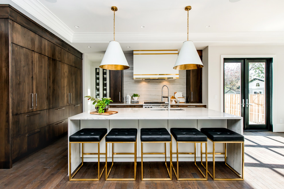 Example of a large transitional l-shaped dark wood floor and brown floor eat-in kitchen design in Calgary with a double-bowl sink, flat-panel cabinets, marble countertops, white backsplash, stone slab backsplash, paneled appliances, an island and dark wood cabinets