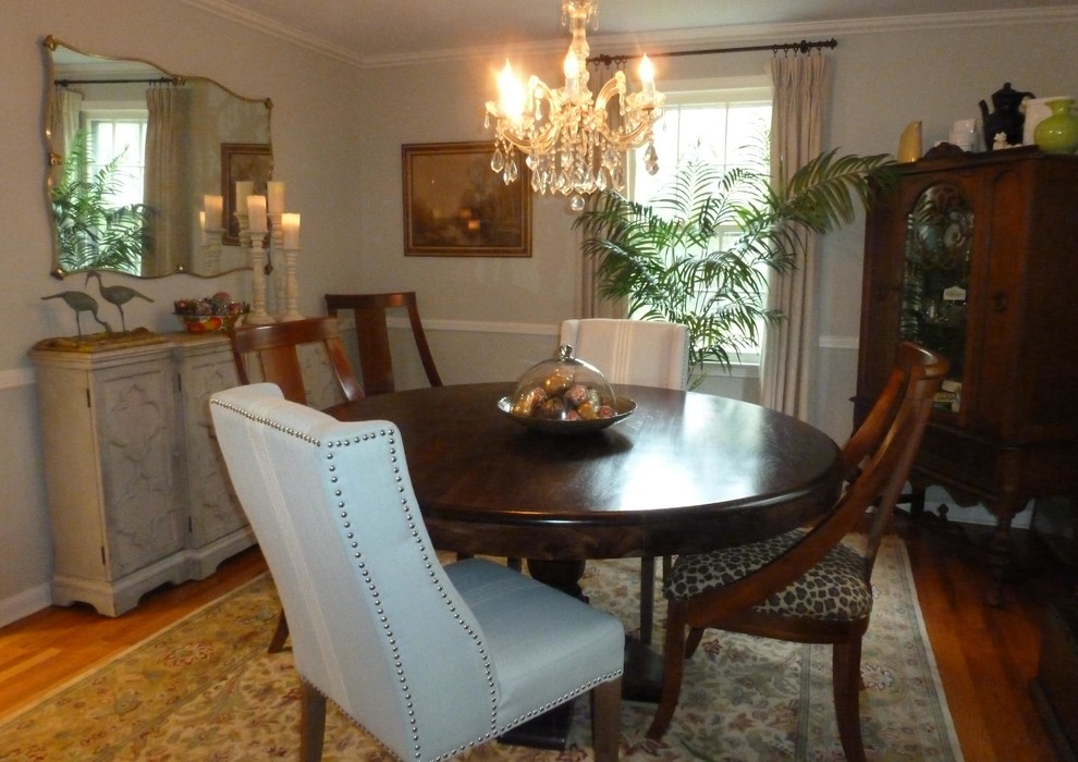 This is an example of a mid-sized transitional separate dining room in Philadelphia with blue walls, medium hardwood floors and no fireplace.