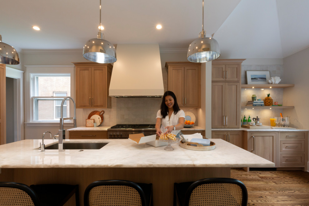 Enclosed kitchen - large transitional l-shaped medium tone wood floor, brown floor and vaulted ceiling enclosed kitchen idea in Chicago with a single-bowl sink, recessed-panel cabinets, gray cabinets, quartzite countertops, white backsplash, ceramic backsplash, paneled appliances, an island and beige countertops