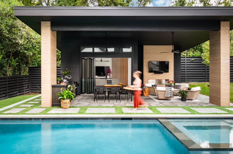 Example of a trendy pool design in Charlotte with a bbq area