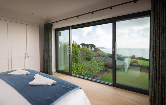 A Coastal Haven with Unmatched Elegance coastal-bedroom