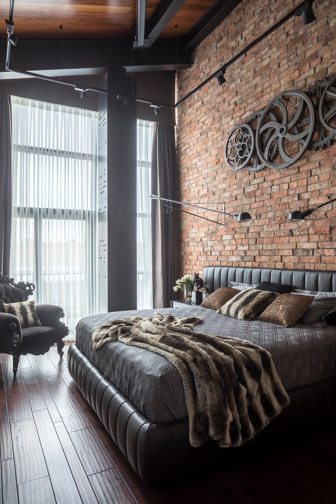 Design ideas for an industrial master bedroom in Moscow with brown floor, brown walls and dark hardwood floors.