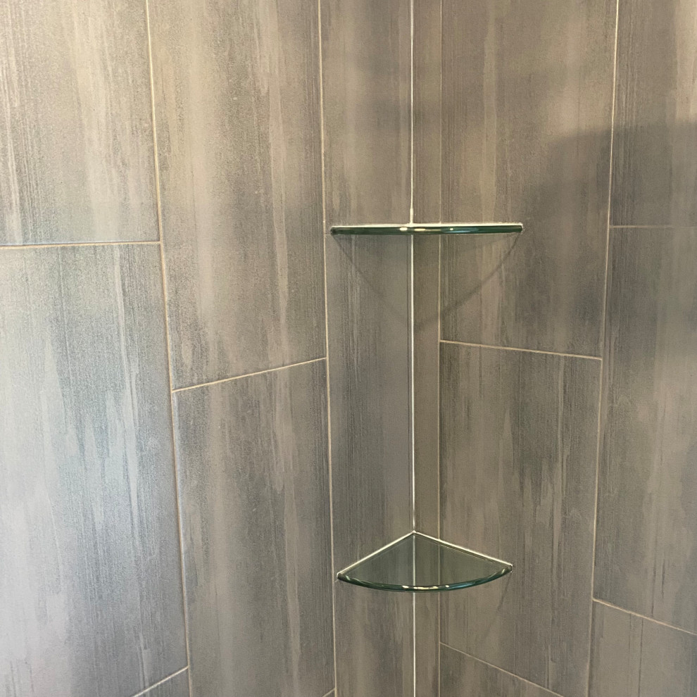 Freestanding bathtub - huge transitional master porcelain tile porcelain tile, gray floor and single-sink freestanding bathtub idea with recessed-panel cabinets, a one-piece toilet, an undermount sink, quartzite countertops, white countertops and a built-in vanity