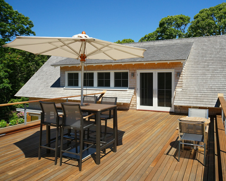 Large contemporary rooftop deck in Boston with no cover.