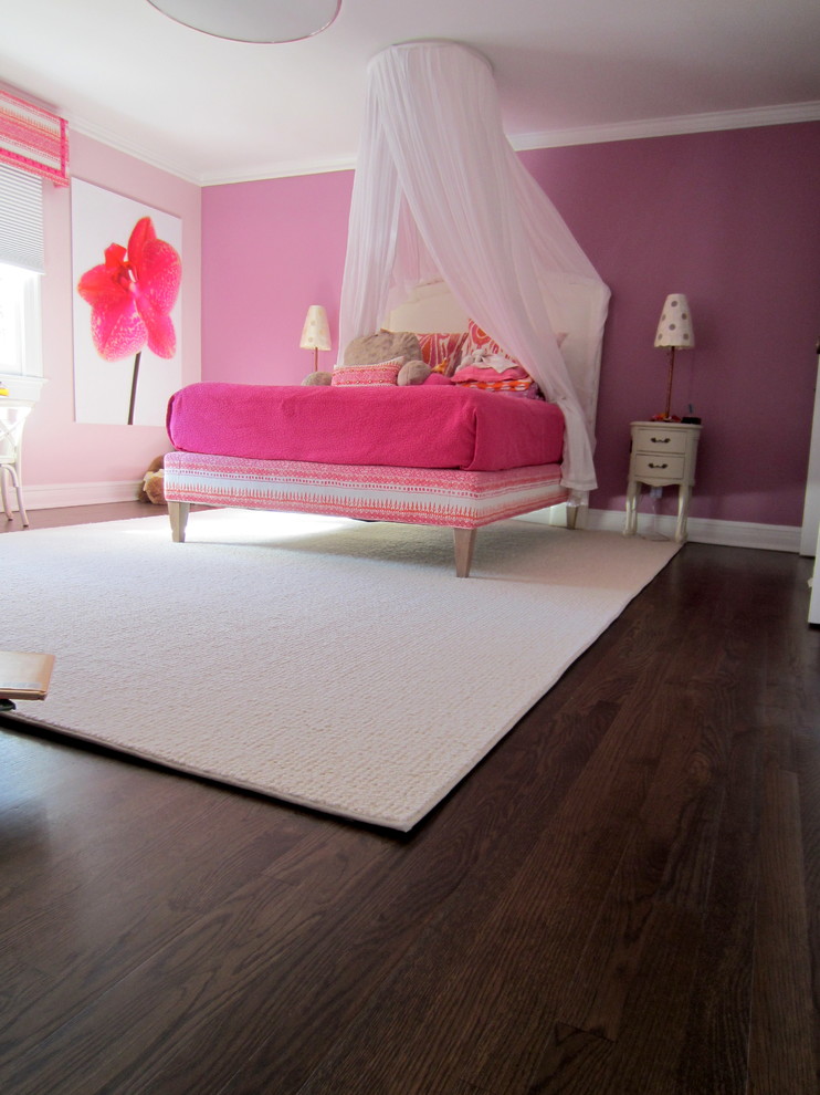 Inspiration for a mid-sized transitional master bedroom in New York with pink walls, dark hardwood floors and no fireplace.