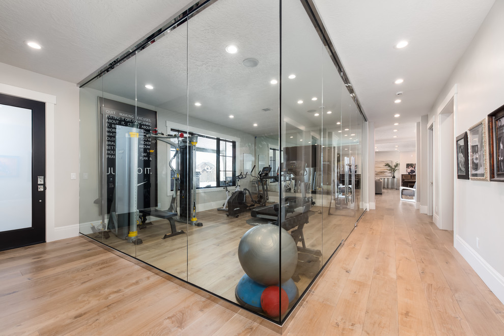 Mid-sized transitional home weight room in Salt Lake City with beige walls, light hardwood floors and beige floor.