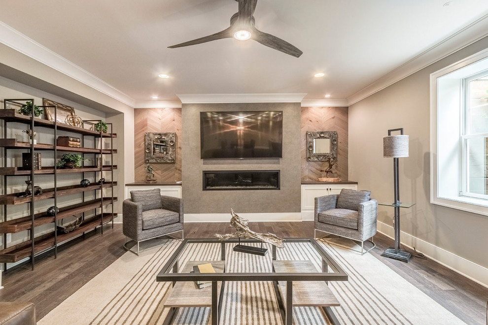 This is an example of a large traditional open concept family room in Columbus with brown walls, medium hardwood floors, a ribbon fireplace, a wall-mounted tv and brown floor.