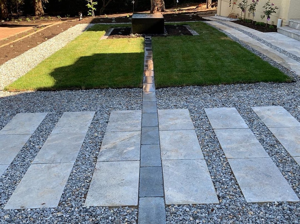 Photo of an expansive traditional front yard partial sun formal garden in Canberra - Queanbeyan with with pond and natural stone pavers.