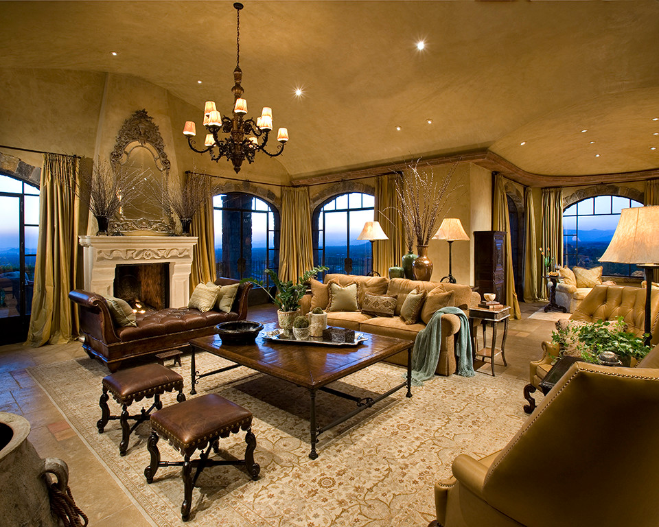 Design ideas for a large traditional formal open concept living room in Phoenix with beige walls, a standard fireplace, a stone fireplace surround, no tv and brown floor.