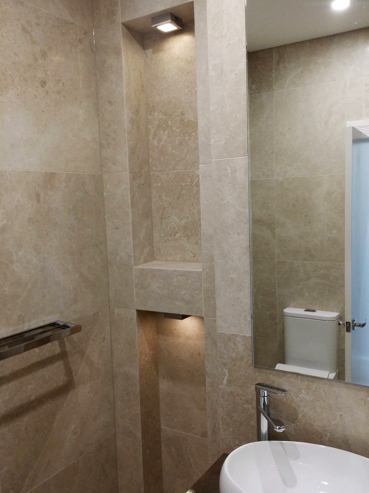 Mid-sized modern 3/4 bathroom in Sydney with flat-panel cabinets, white cabinets, an open shower, a two-piece toilet, beige tile, stone tile, beige walls, marble floors, a trough sink and engineered quartz benchtops.