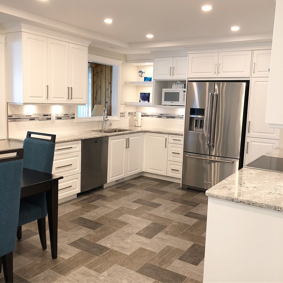 Inspiration for a transitional kitchen remodel with white cabinets and quartz countertops