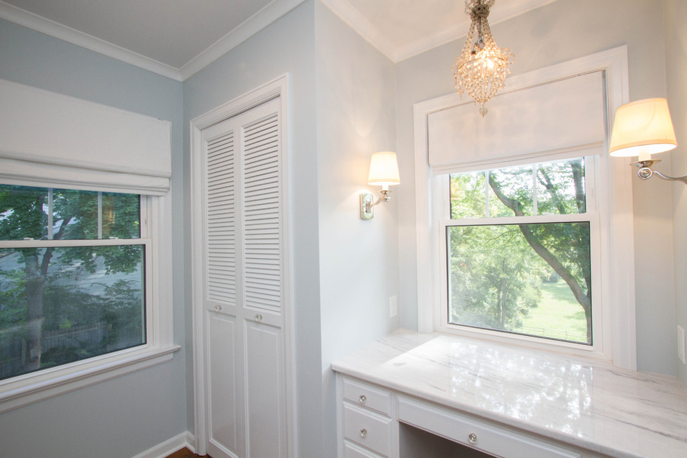 Alcove shower - mid-sized transitional master white tile and ceramic tile bamboo floor and brown floor alcove shower idea with raised-panel cabinets, white cabinets, a two-piece toilet, an undermount sink, granite countertops and gray walls