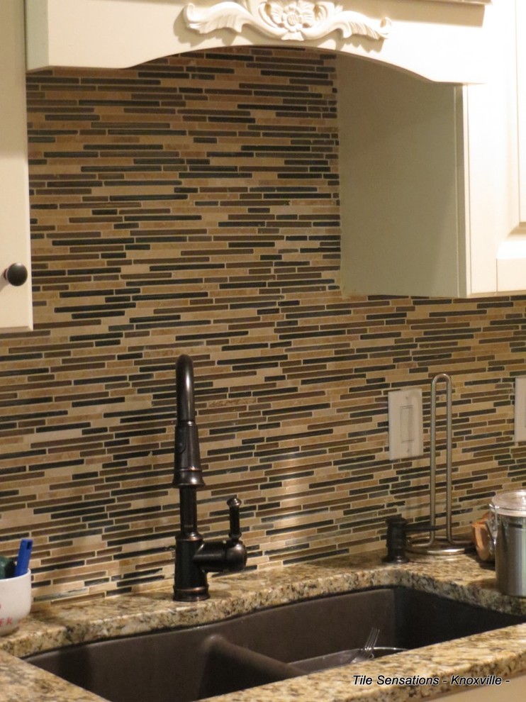 Inspiration for a transitional kitchen remodel with a double-bowl sink, raised-panel cabinets, white cabinets, granite countertops, brown backsplash and matchstick tile backsplash