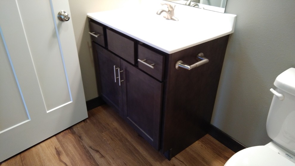 Small transitional kids' vinyl floor and brown floor bathroom photo in Cedar Rapids with shaker cabinets, gray cabinets and an integrated sink