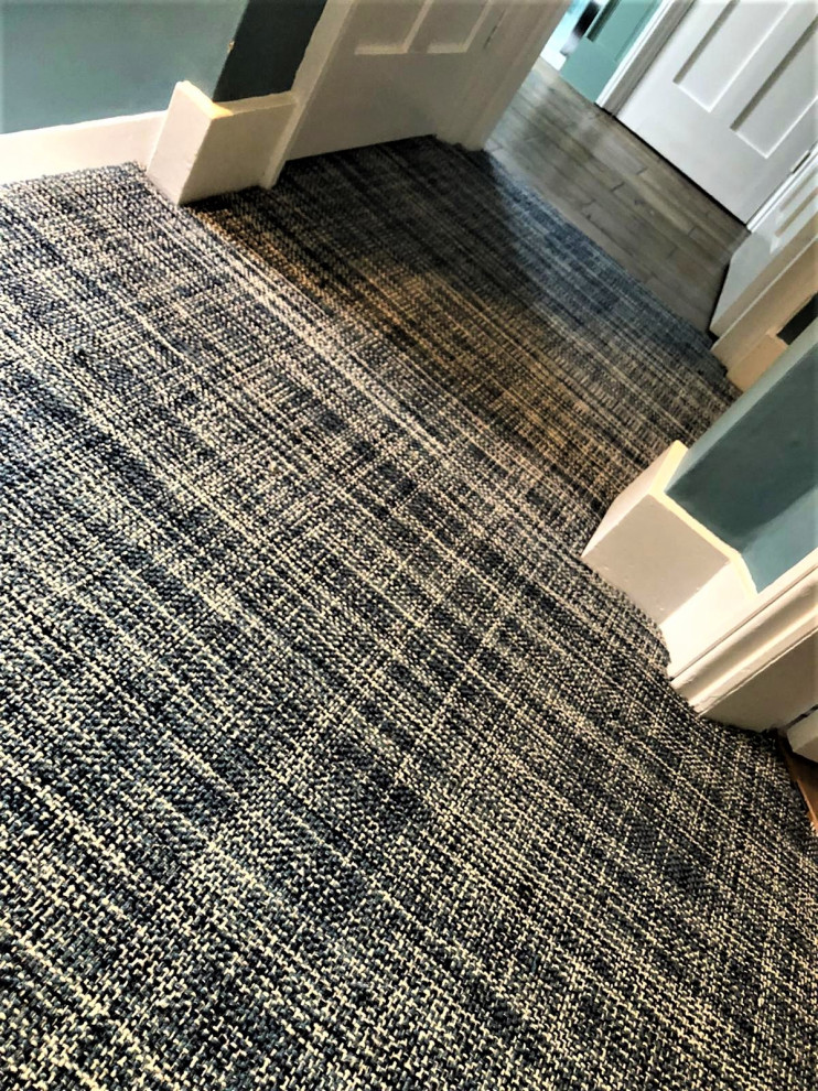 Inspiration for a large modern hallway in Hertfordshire with blue walls, carpet and blue floor.