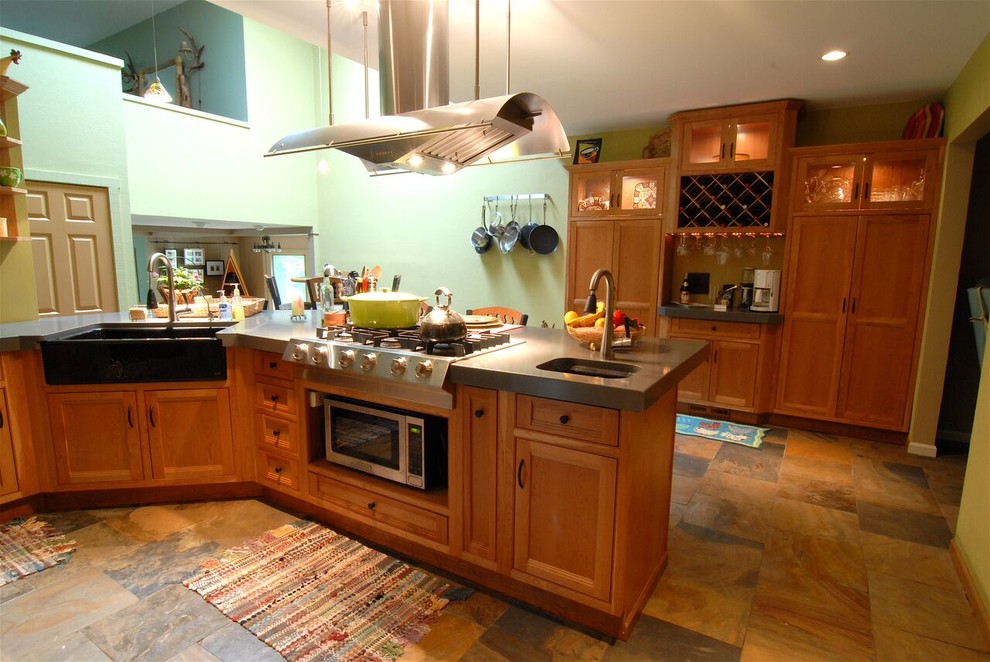 Open concept kitchen - large transitional l-shaped slate floor and multicolored floor open concept kitchen idea with an undermount sink, shaker cabinets, medium tone wood cabinets, quartz countertops, stainless steel appliances, an island and gray countertops