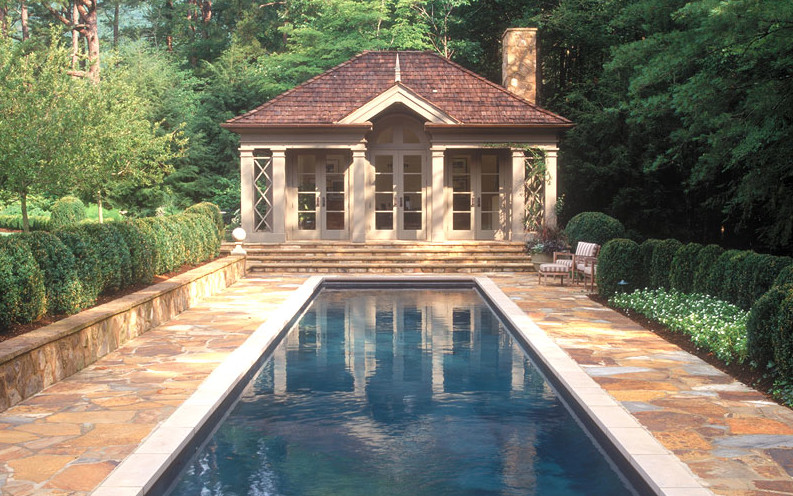 Photo of a mid-sized country courtyard rectangular lap pool in Other with natural stone pavers.