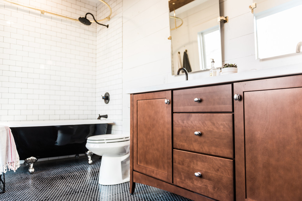 Inspiration for a mid-sized midcentury master bathroom in Dallas with furniture-like cabinets, dark wood cabinets, a claw-foot tub, a shower/bathtub combo, black and white tile, ceramic tile, white walls, ceramic floors, an undermount sink and engineered quartz benchtops.