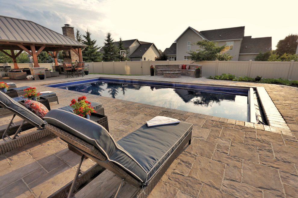 Photo of a mid-sized country backyard full sun garden in Other with with privacy feature and natural stone pavers.