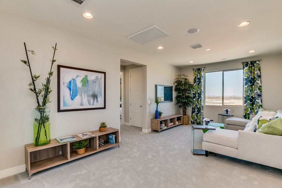 This is an example of a large contemporary loft-style family room in Phoenix with a game room, beige walls, carpet, a wall-mounted tv and beige floor.