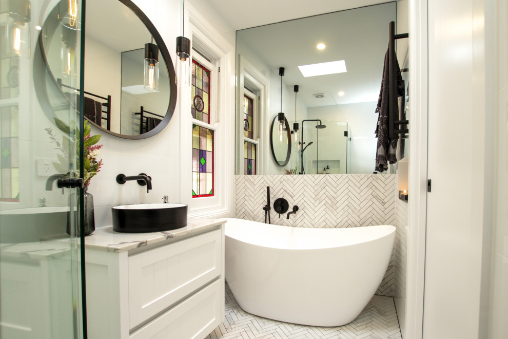Mid-sized contemporary master bathroom in Sydney with shaker cabinets, white cabinets, a freestanding tub, a corner shower, a one-piece toilet, white walls, a vessel sink, a hinged shower door, a niche, a single vanity and a floating vanity.