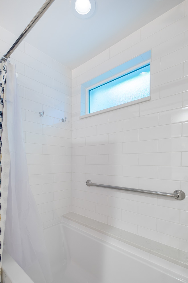 Photo of a mid-sized traditional master bathroom in Portland with recessed-panel cabinets, white cabinets, an alcove tub, a curbless shower, a two-piece toilet, white tile, ceramic tile, blue walls, porcelain floors, an undermount sink and engineered quartz benchtops.