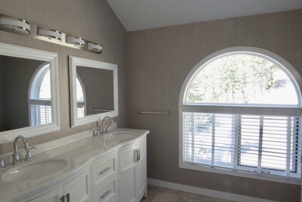 Alcove bathtub - mid-sized craftsman kids' ceramic tile and gray floor alcove bathtub idea with shaker cabinets, white cabinets, a two-piece toilet, gray walls, an undermount sink, marble countertops and white countertops
