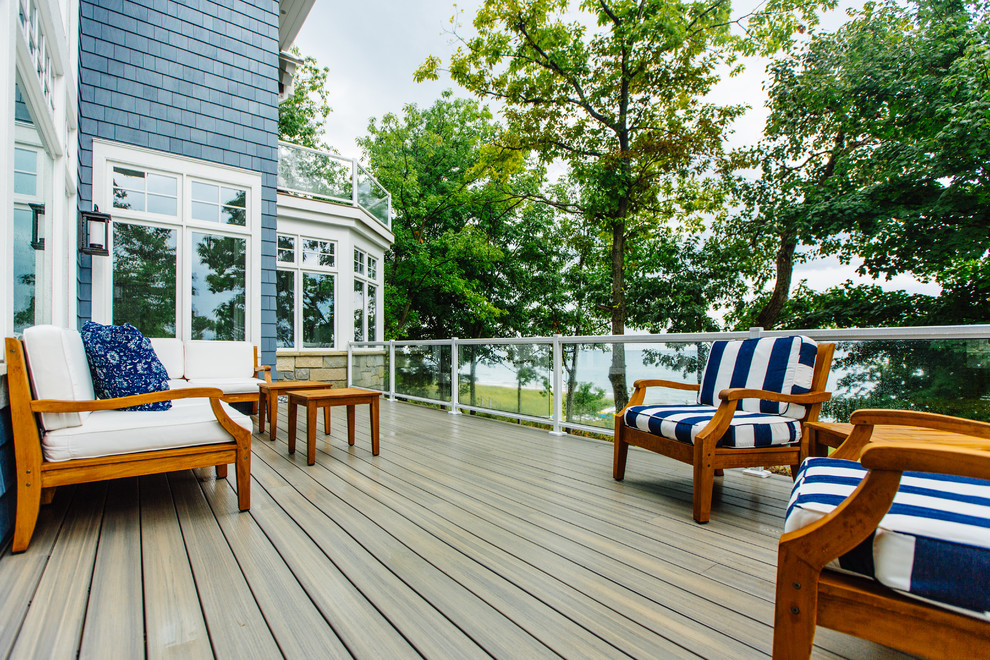 This is an example of a large beach style backyard deck in Other with no cover.