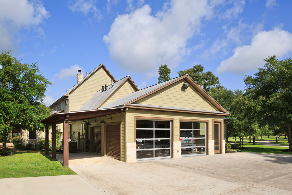 Inspiration for a large mediterranean attached two-car garage remodel in Houston