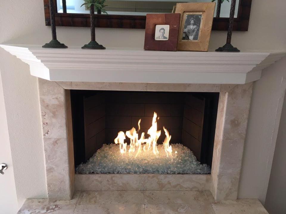 Living room - mid-sized transitional formal and enclosed travertine floor and beige floor living room idea in San Diego with beige walls, a standard fireplace, a tile fireplace and a wall-mounted tv