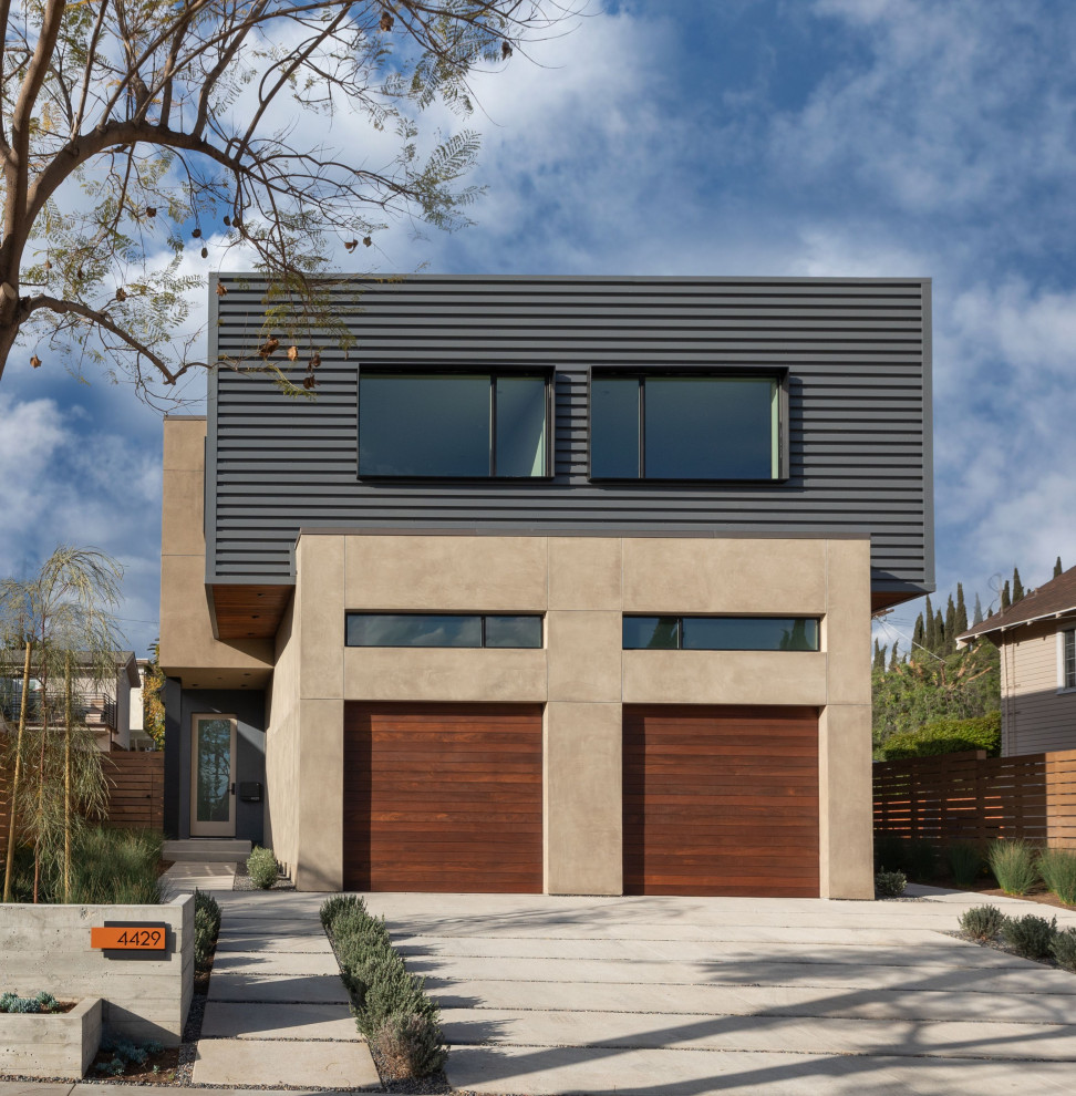 This is an example of a modern two-storey duplex exterior in Los Angeles with metal siding.
