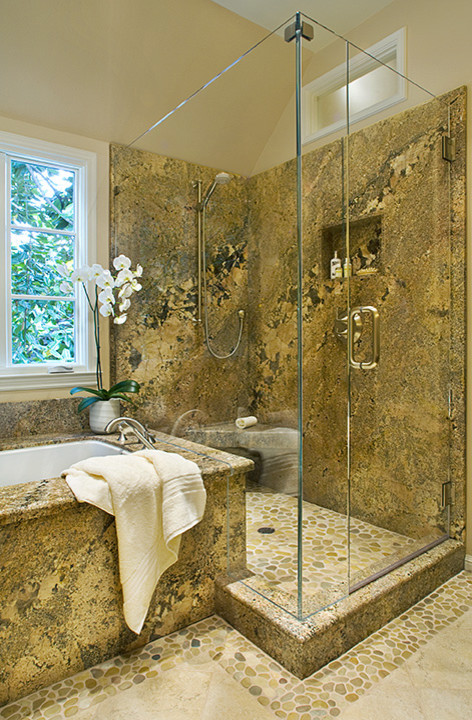 Photo of a large transitional master bathroom in San Francisco with dark wood cabinets, granite benchtops, beige tile, porcelain floors, shaker cabinets, an undermount tub, a corner shower, a one-piece toilet, pebble tile, beige walls and an undermount sink.
