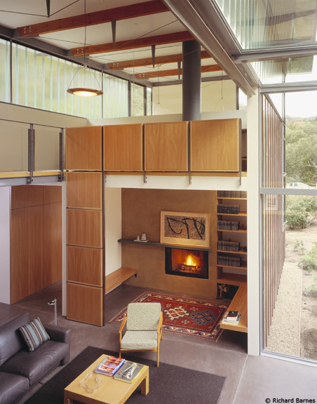This is an example of a mid-sized contemporary formal open concept living room in San Francisco with white walls, concrete floors, a standard fireplace, a metal fireplace surround, no tv and grey floor.