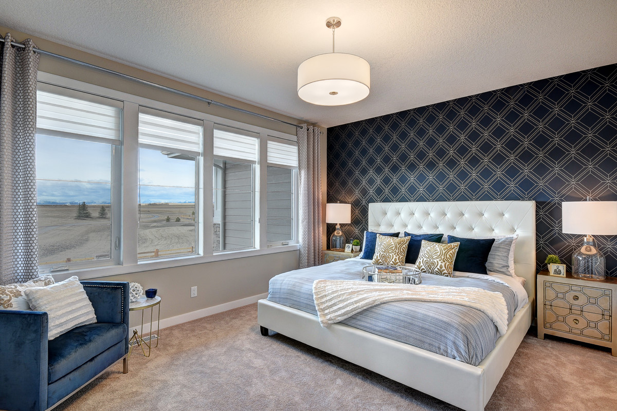 Mid-sized transitional master carpeted and beige floor bedroom photo in Calgary with multicolored walls and no fireplace