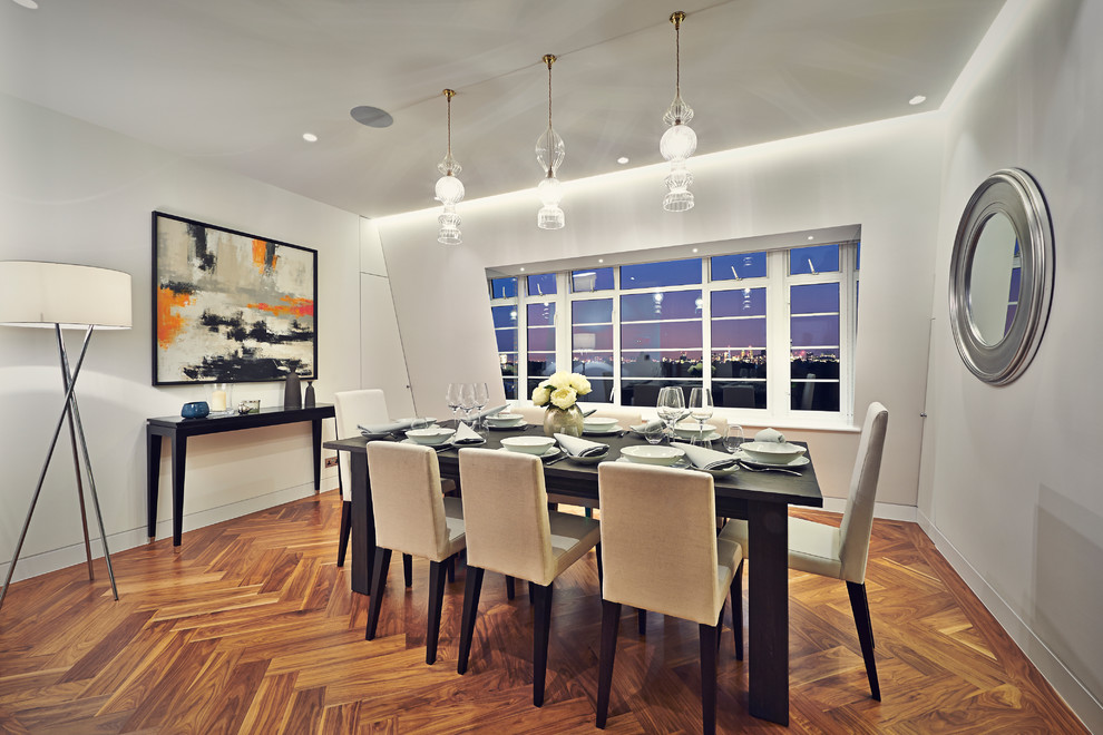 Design ideas for a small contemporary dining room in Surrey.