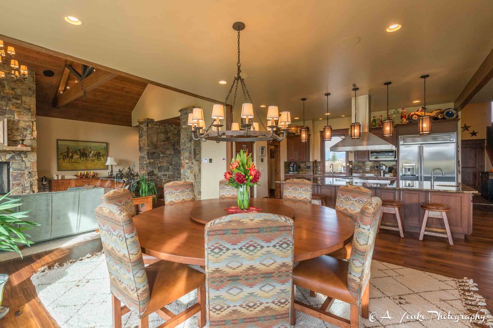 Inspiration for a mid-sized country kitchen/dining combo in Other with beige walls, dark hardwood floors and no fireplace.