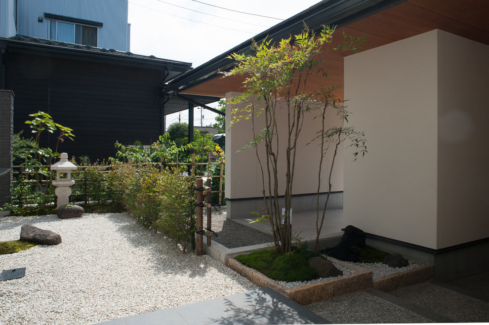 Design ideas for an asian front yard partial sun outdoor sport court in Other with a garden path and gravel.