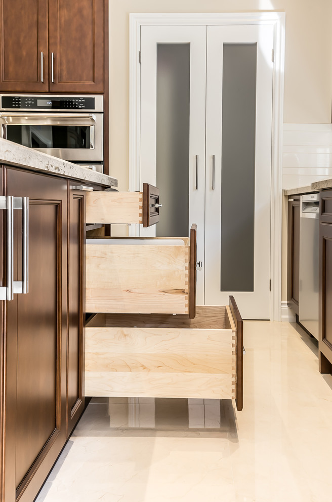 Example of a transitional kitchen design in Toronto