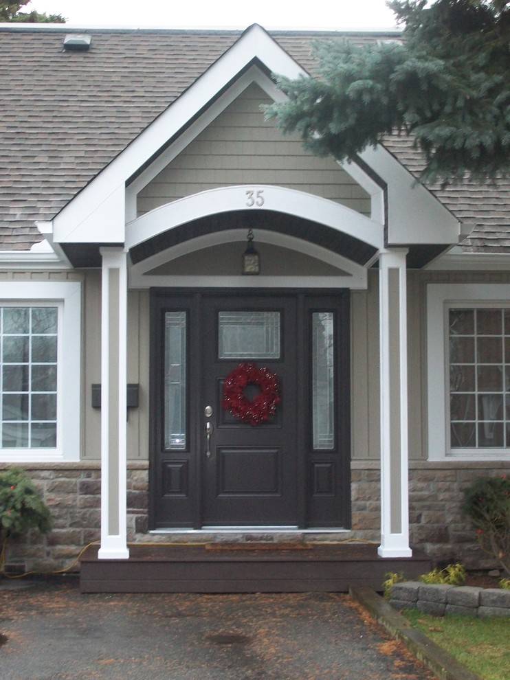 Example of a small classic single front door design with a brown front door