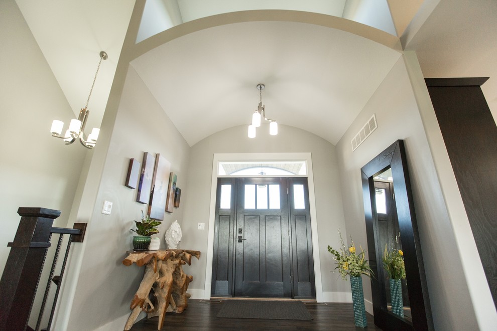 Example of a small transitional dark wood floor and brown floor front door design in Chicago with gray walls and a dark wood front door