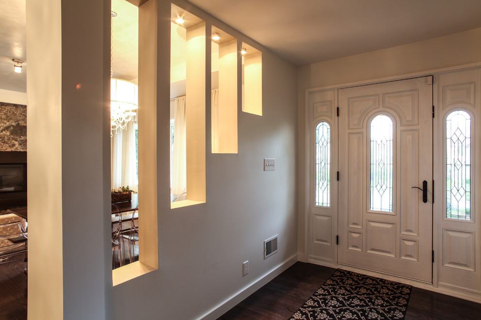 Inspiration for a mid-sized modern dark wood floor front door remodel in Indianapolis with beige walls and a white front door
