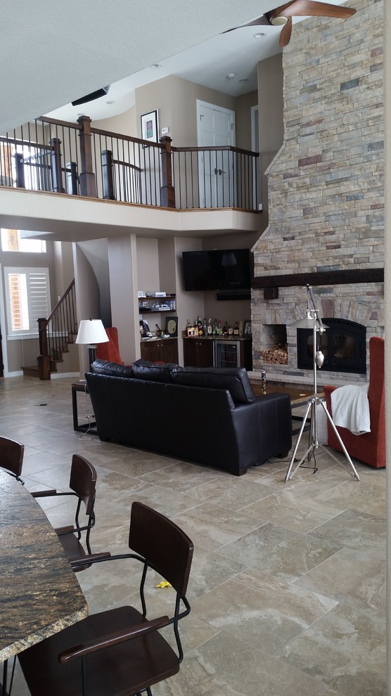 Example of a transitional living room design in Denver