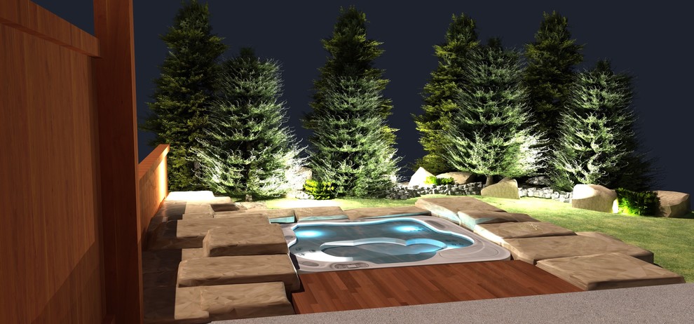Design ideas for a mid-sized traditional backyard custom-shaped pool in Calgary with natural stone pavers and a hot tub.