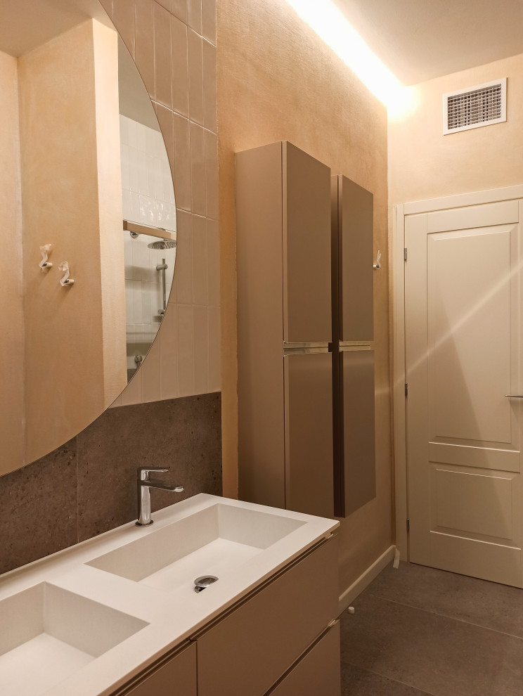 Mid-sized contemporary master bathroom with grey cabinets, a curbless shower, a one-piece toilet, concrete floors, grey floor, a sliding shower screen and a double vanity.