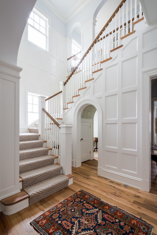 Traditional wood l-shaped staircase in Richmond with wood risers and wood railing.