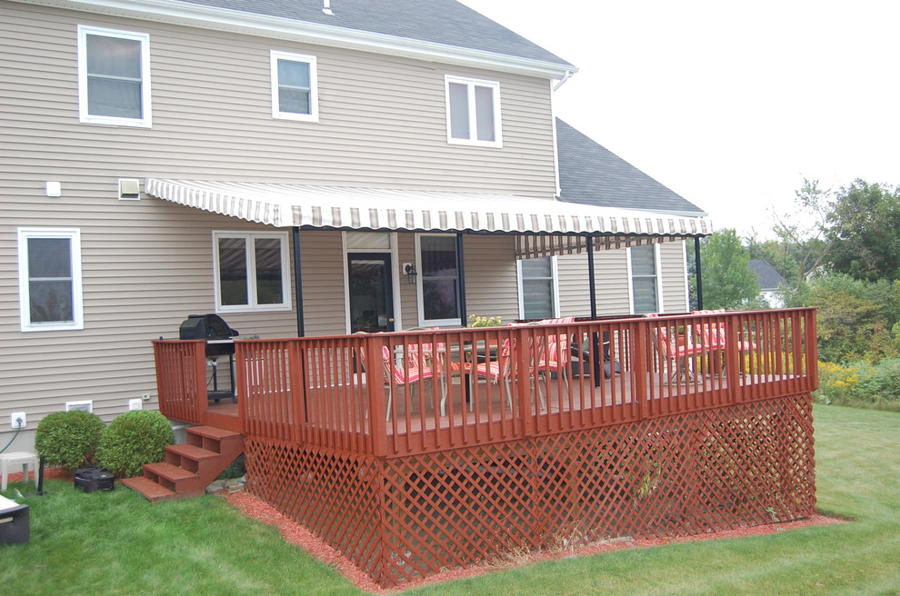 Backyard deck in Burlington with an awning.