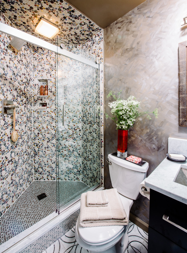 Small eclectic 3/4 bathroom in DC Metro with a drop-in sink, flat-panel cabinets, dark wood cabinets, marble benchtops, an open shower, a one-piece toilet, multi-coloured tile, ceramic tile, multi-coloured walls and marble floors.