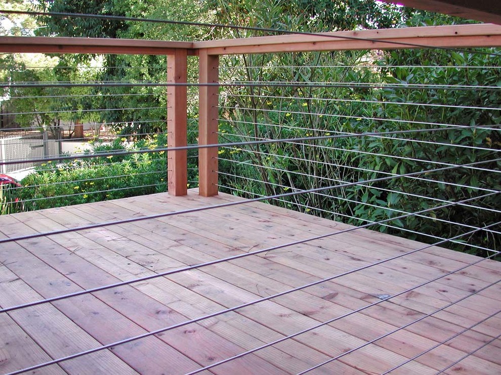 Design ideas for a transitional backyard and first floor deck in San Francisco with cable railing.