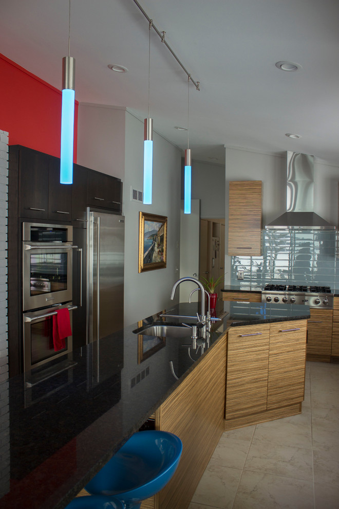 Photo of a large contemporary kitchen in Other with an undermount sink, flat-panel cabinets, granite benchtops, blue splashback, glass tile splashback, stainless steel appliances, ceramic floors and with island.