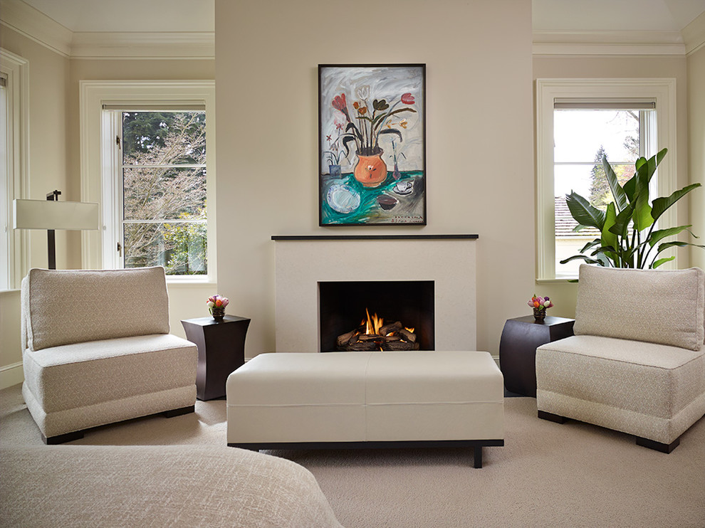 This is an example of a large transitional open concept living room in Seattle with carpet, a standard fireplace, a stone fireplace surround and no tv.